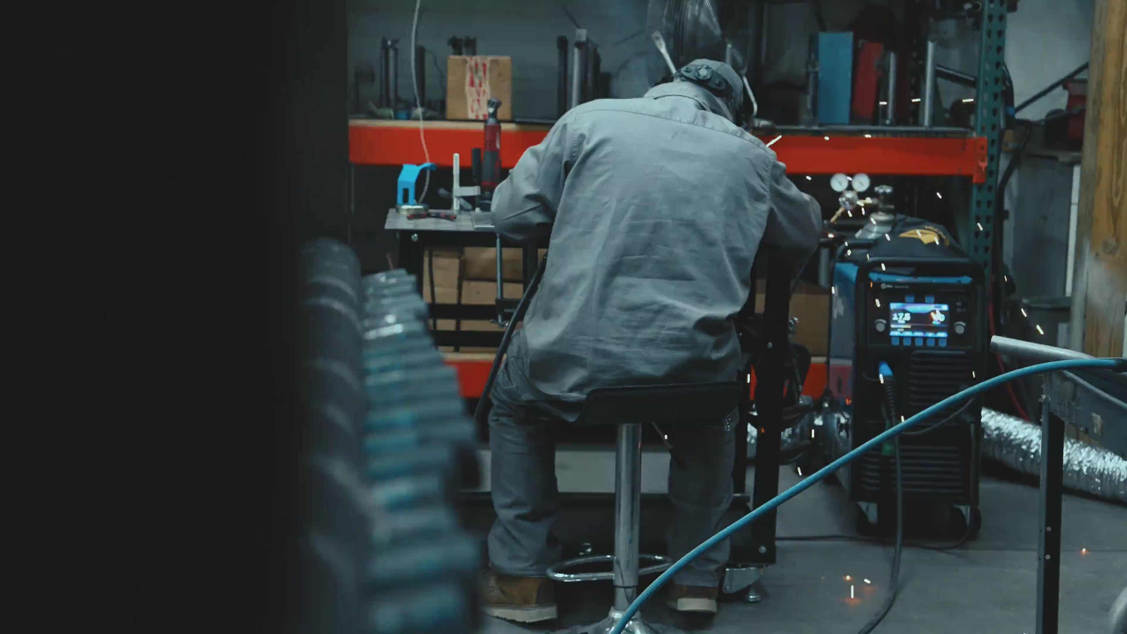 Load video: Background video of SBC employees manufacturing motorcycle parts